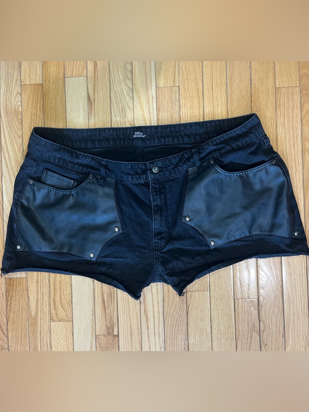 Social collision leather pocket shorts